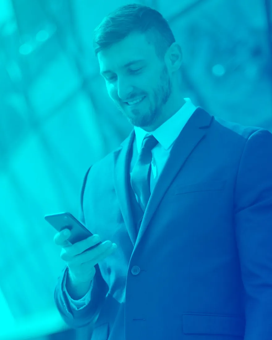 Blue duotone: professional with a smartphone against glass architecture