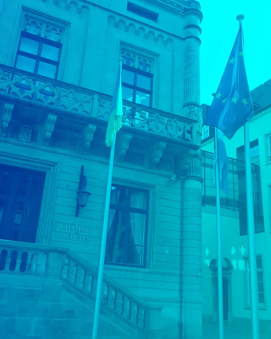 Blue duotone: Luxembourg government quarter with flags